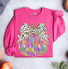 Magenta Pumpkin Art Crewneck with vibrant applique and polka-dot bow design, offering style and comfort. Gildan 50/50 cotton-poly blend.