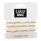 LULU MAC - PURE CHARM BRACELET TRIO showcasing delicate pearls and gold beading on a display card.