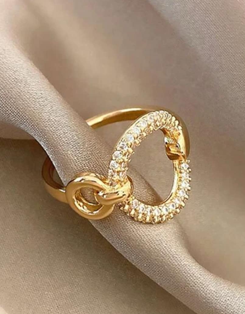 Elegant gold-tone Cocktail Ring with sparkling Cubic Zirconia, featuring an adjustable design for a perfect fit.