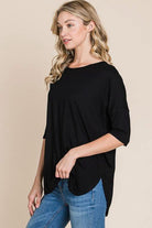 Woman wearing a black Girlfriend Crew - BomBom, showcasing its soft fabric and relaxed fit.