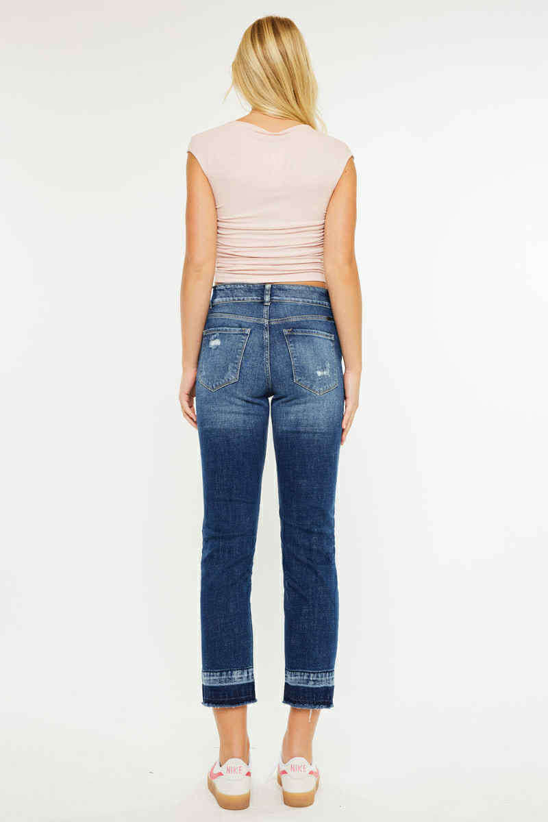 Model wearing Kancan Georgia Ultra High Rise Slim Straight Leg Jeans from the back, showcasing rich dark wash and distressing.