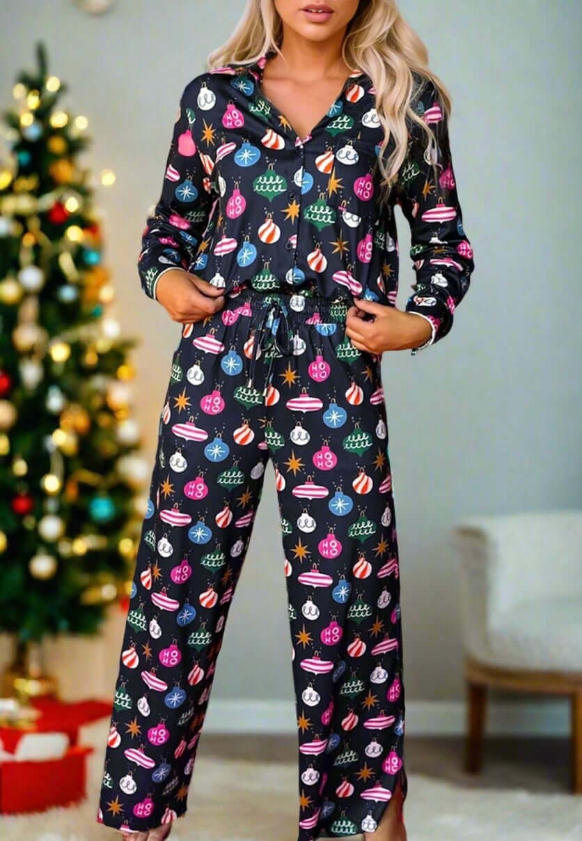 Festive women's pajamas with holiday decorations, drawstring waist, and long sleeves, perfect for cozy relaxation.