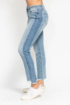 Side view of JUDY BLUE - HADLEY JEANS featuring a high-rise fit, side panel detail, and hi-lo fray hem.