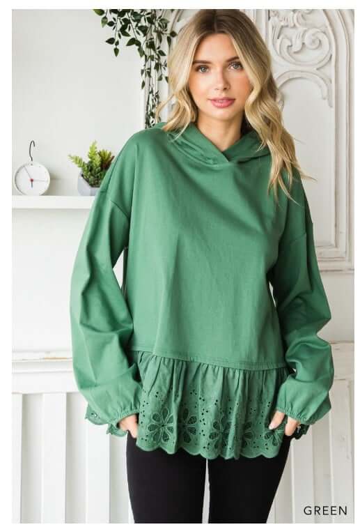 Green Cotton Bleu Adventure Awaits hoodie top with eyelet ruffle detail, shown on model in cozy, oversized style.