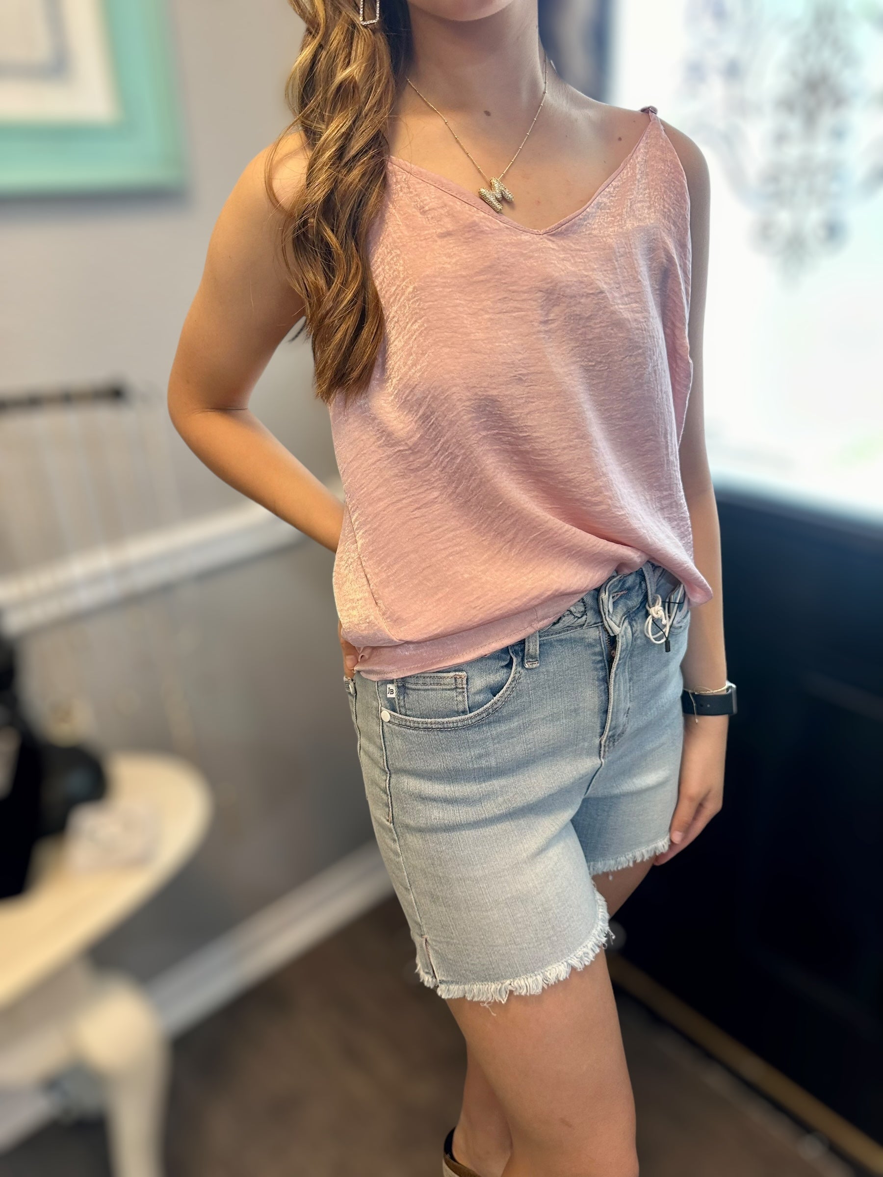 MAGIC FIT Cami in pink worn with denim shorts, showcasing its stylish reversible design for versatile outfits.