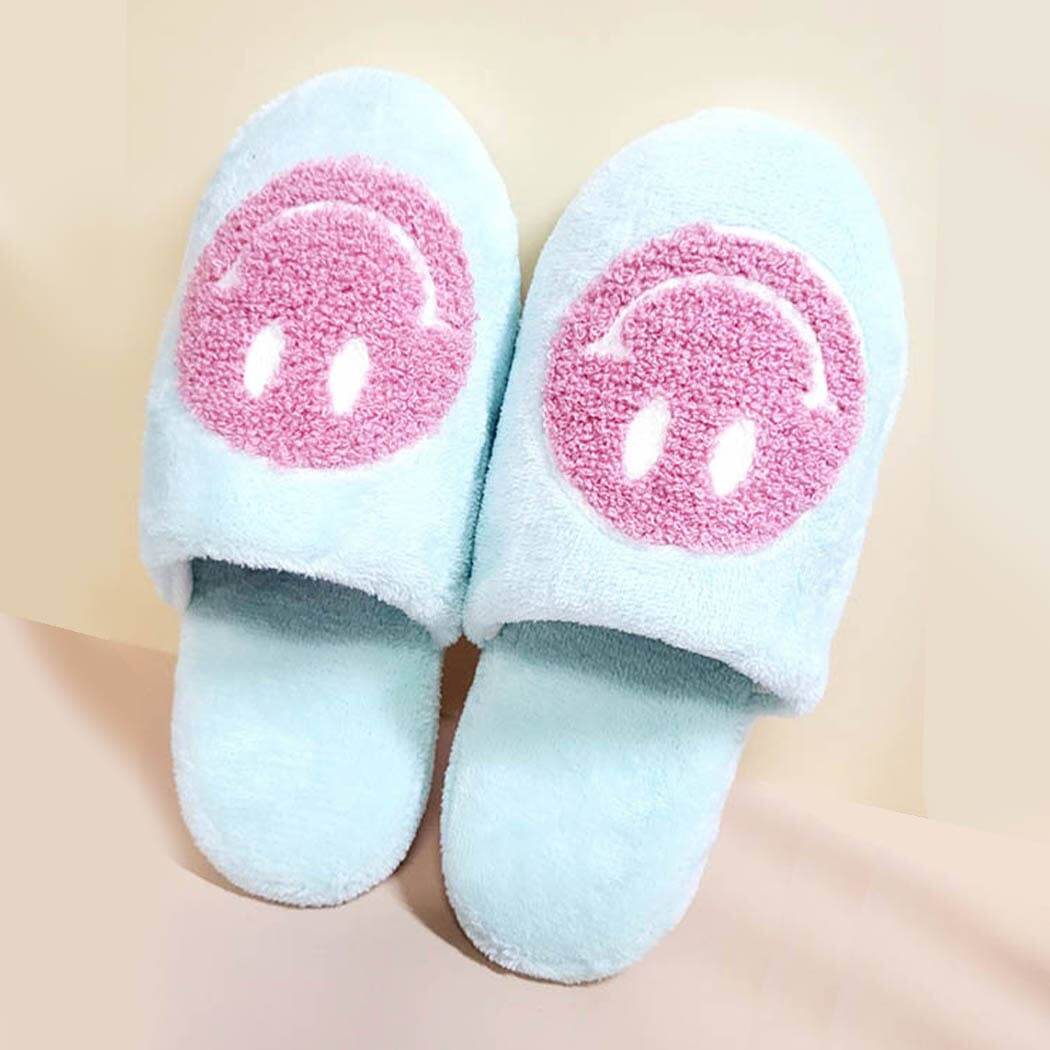 Cozy aqua indoor slide slippers with a pink smiley face design for women. Perfect for home relaxation in style.