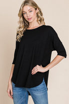 Stylish woman modeling the black Girlfriend Crew - BomBom, showcasing its buttery soft fabric and comfortable half sleeves.