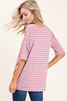 Model wearing soft mauve striped top with relaxed fit, perfect for casual outings and everyday wear.