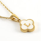 MONOGRAM MOMENTS NECKLACE with gold chain and white letter L pendant, perfect for personal style and timeless elegance.