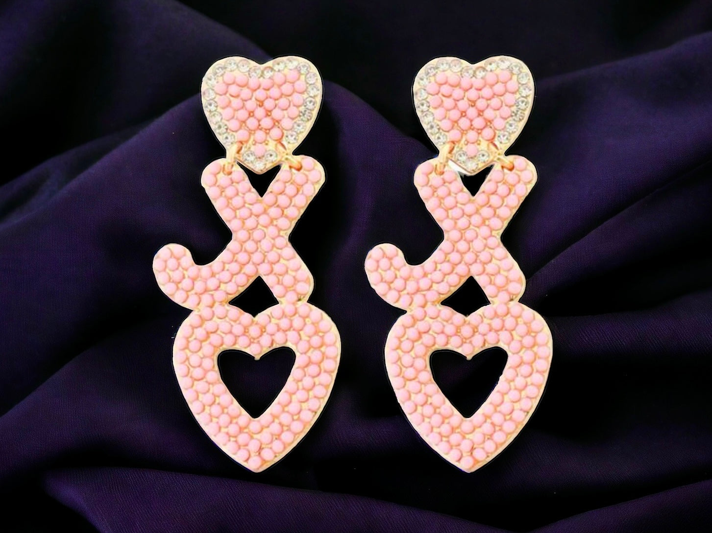 HUGS & KISSES Earrings featuring pink hearts and love symbols, perfect for adding charm to any outfit.