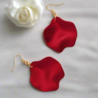 Elegant red ruffle earrings by Vivian-Lu with gold-tone hooks against a soft background. Perfect for elevating any outfit.