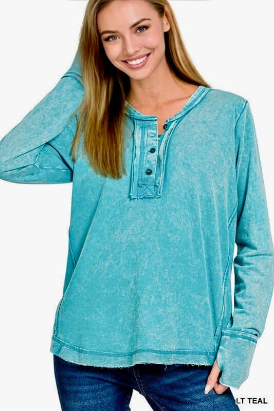 Wanderlight Henley Top (teal) featuring a relaxed fit, scoop neckline, and thumb hole cuffs for casual elegance.