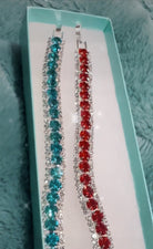 MISS SPARKLING Bracelet by Teal Tiger Boutique $25.00 Gorgeous rhinestone bracelets in teal, red, and mint! Comes with box and one bracelet in your choice of color. Teal Tiger Boutique