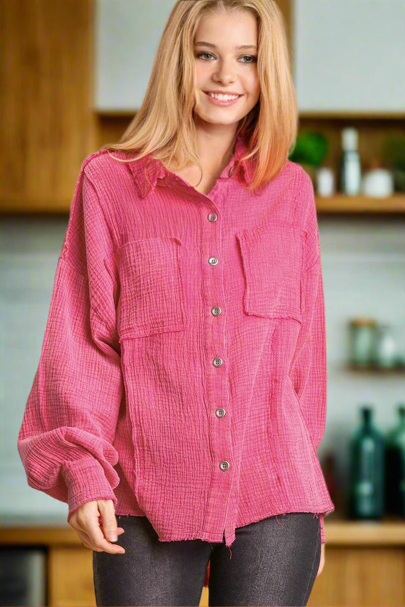 Model wearing the versatile 'That Pretty Feeling Top' in pink, featuring a button-down design and high-low hem.