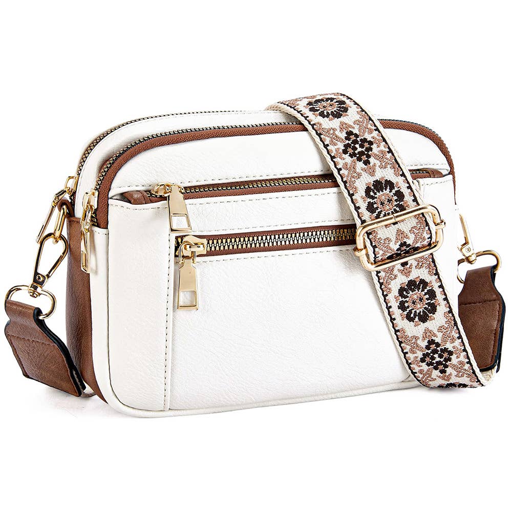 The NATASHA Crossbody Bag in white with floral woven guitar strap, perfect for comfort and style, ideal for any modern woman.