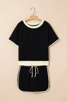Boardwalk Breeze Skort Set in black, featuring a relaxed-fit top and matching drawstring skort for sporty style.
