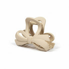 DAILY DARLING BOW HAIR CLIP (6 colors) in soft beige, featuring a modern bow design for everyday styling.