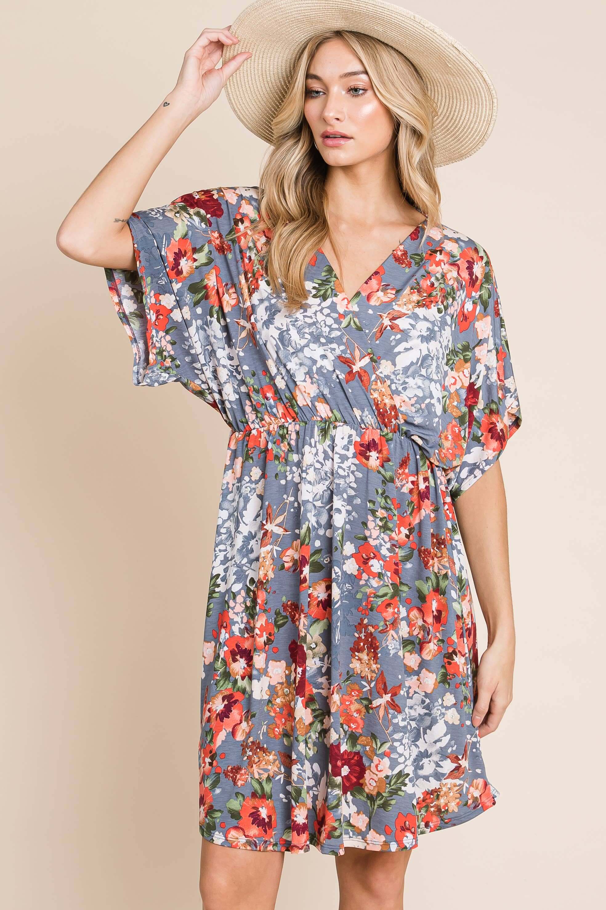 Model wearing DA1475 Wrap V-Neck Midi Dress in floral print, showcasing a relaxed fit and flowy fabric.