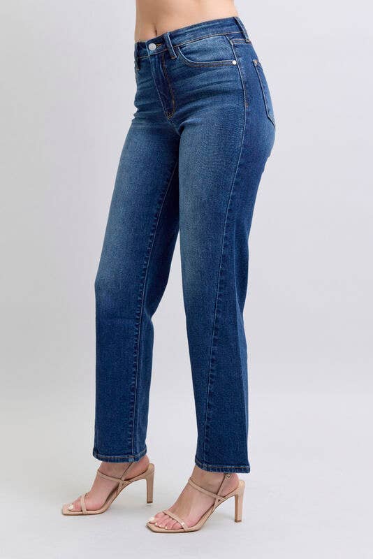 JUDY BLUE - NOELLE JEANS displayed on a model showcasing the high-rise, wide leg cut and deep dark wash denim.