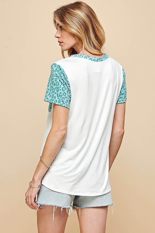 Back view of women's animal print contrast round neck t-shirt with leopard sleeves and white body.