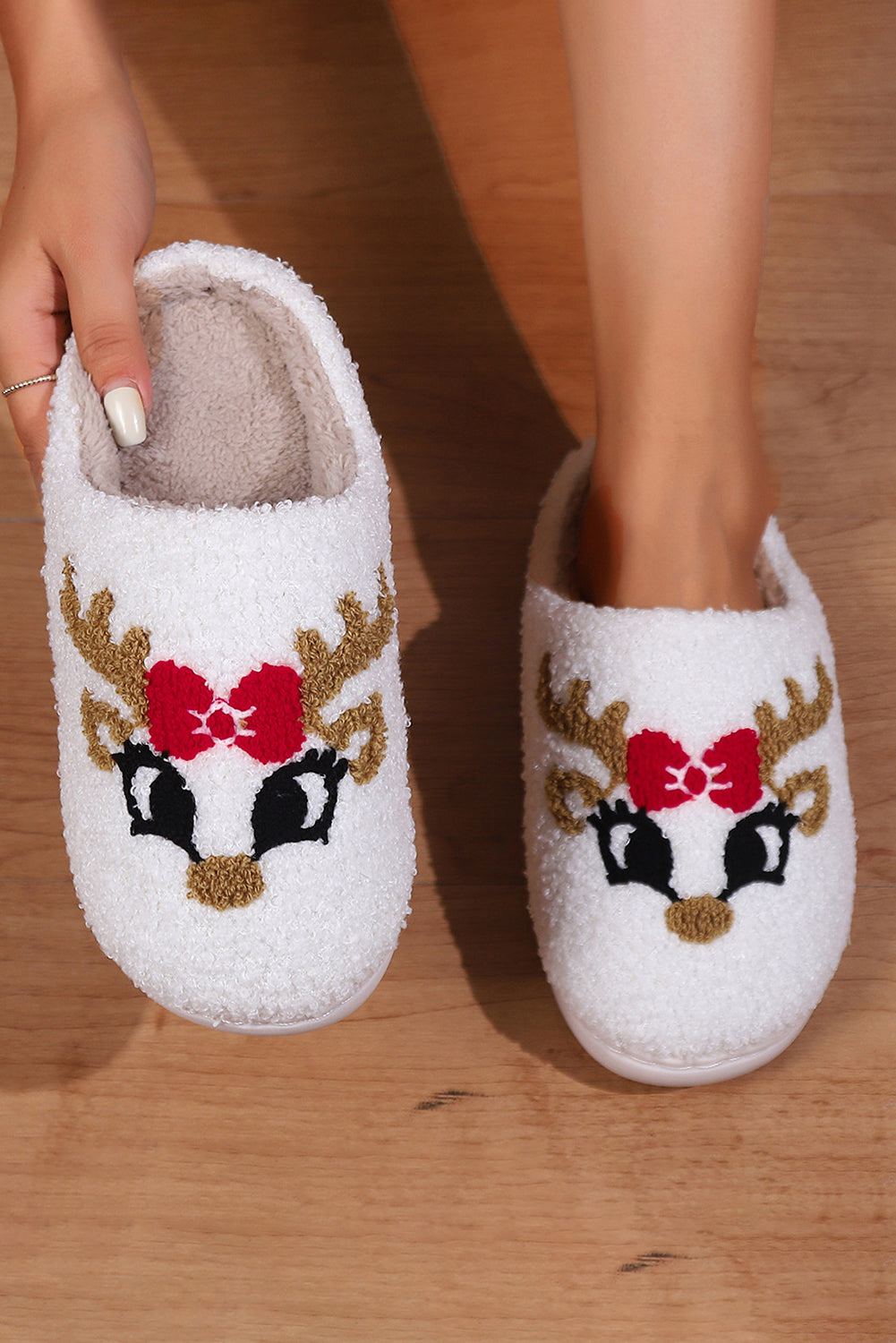 Cozy Cupid the Reindeer Slippers with cute reindeer design and nonslip bottoms, perfect for the holiday season comfort.