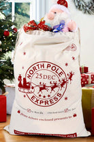 Jumbo Santa bag with North Pole Express design, filled with gifts, perfect for festive holiday celebrations.