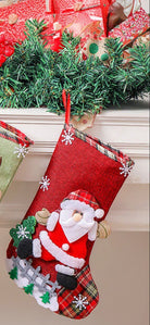 Santa's stocking filled with gifts, featuring red burlap, plaid details, and festive felt applique, hanging by the fireplace.