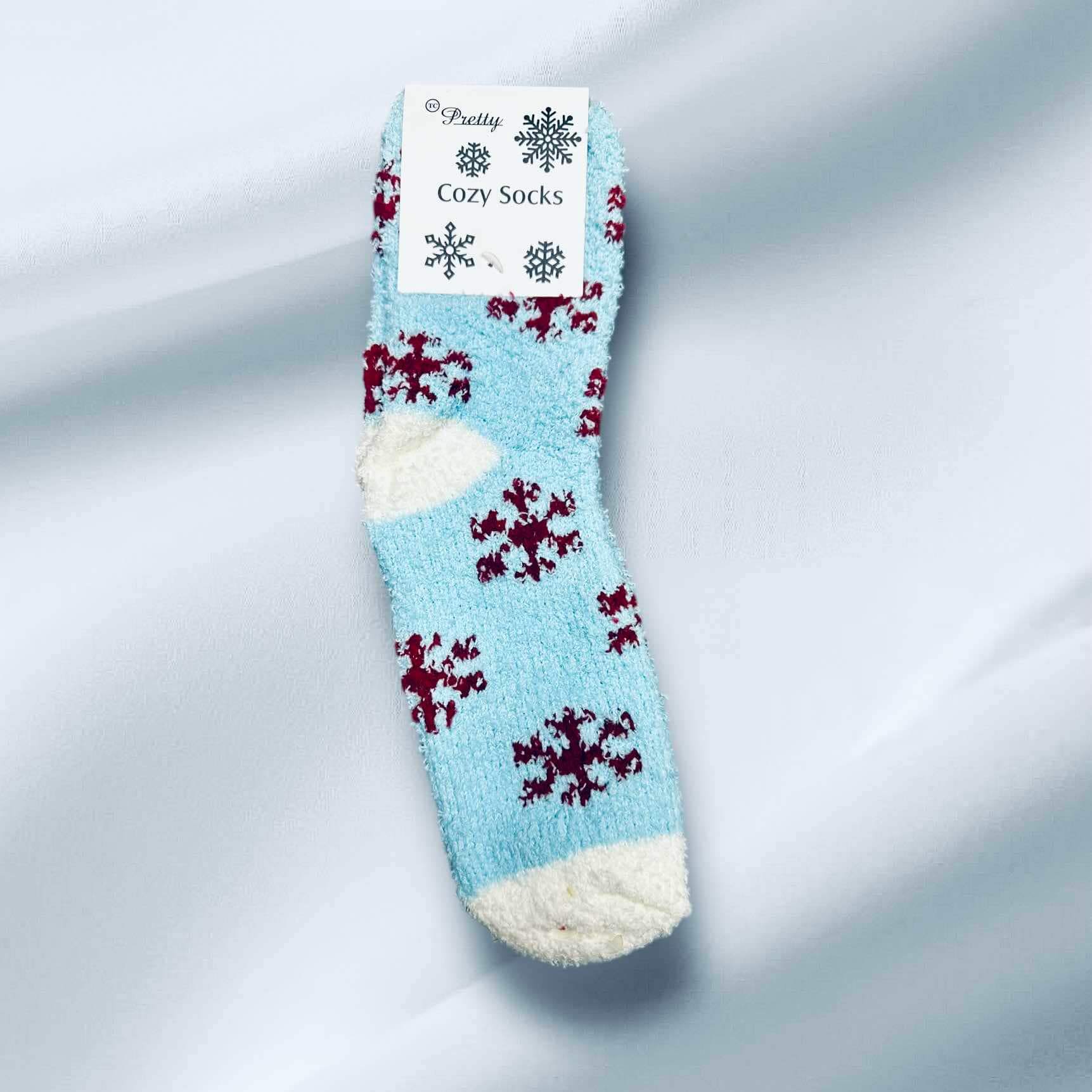 Winter Snowflake Sherpa Socks in blue with red snowflakes, offering warmth and style for cold weather.