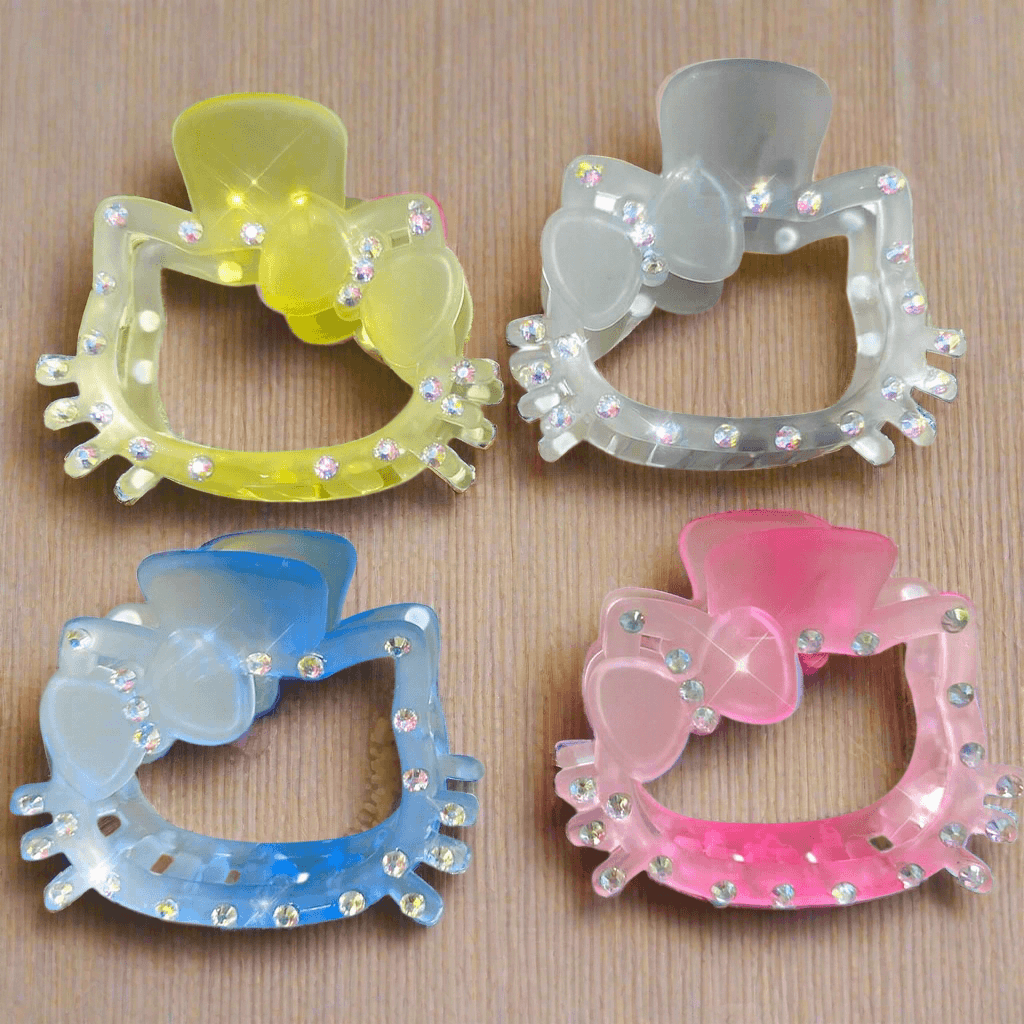 Colorful large kitten hair clips with rhinestones and bows, perfect for stylish hairstyles.