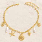 High Tide Treasures charm necklace with seashells, starfish, and faux pearls on a gold-tone chain.