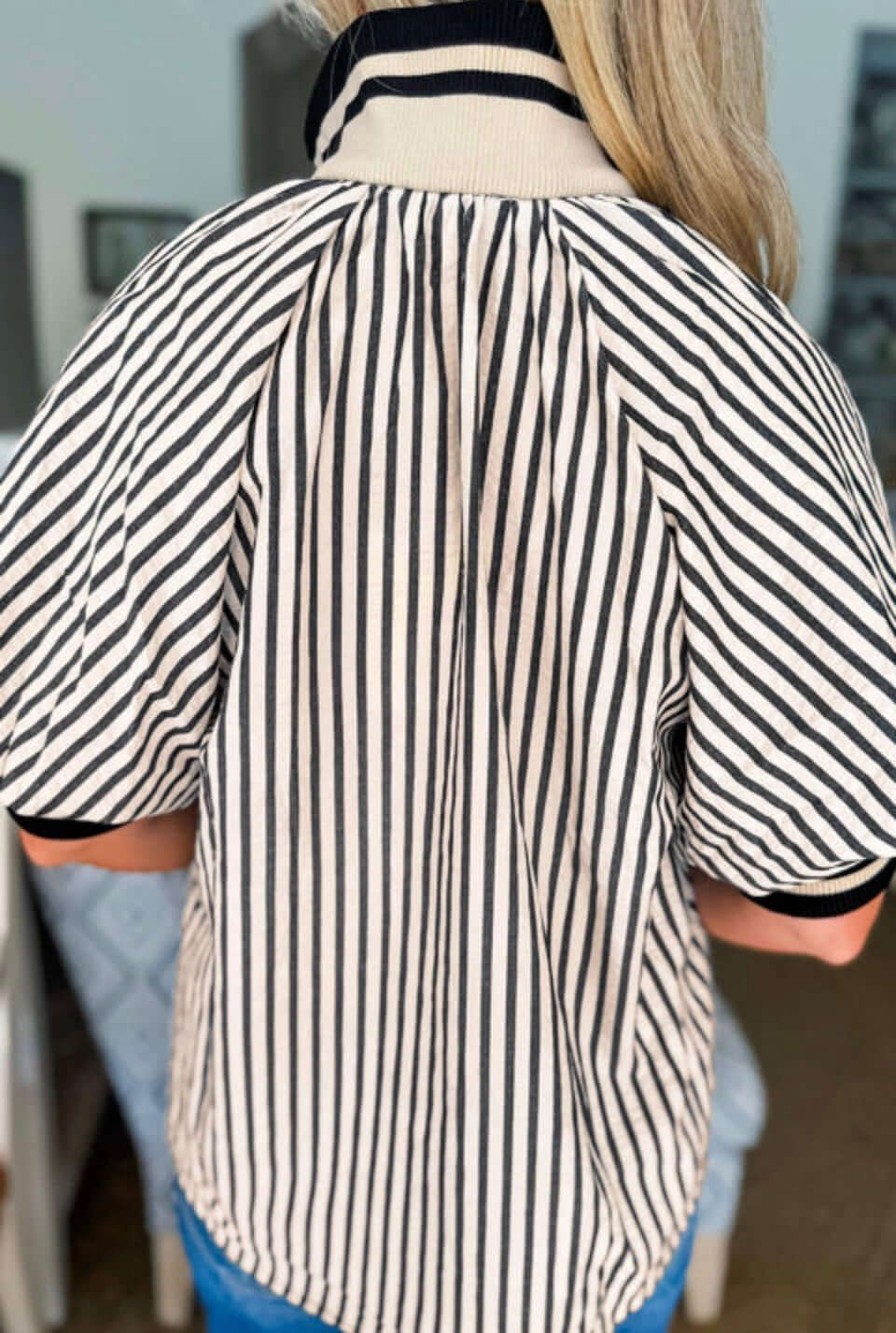 Back view of the Classic Current Top showcasing its timeless striped design and polished collar.