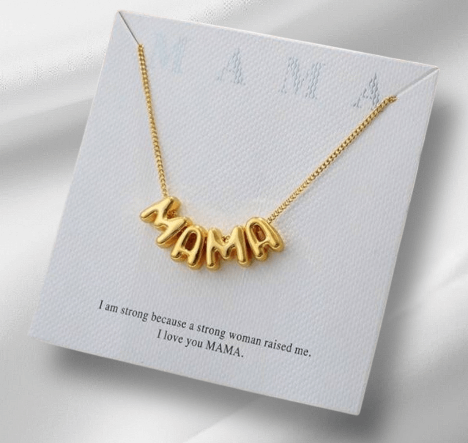 Bubbly Mama Necklace in gold tone with 'MAMA' charm on elegant gift card background.