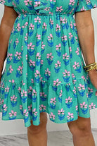 Aqua floral print mini dress with ruffled hem and frilled neckline, perfect for springtime charm.