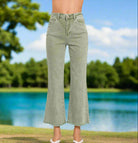 Find Your Way jeans by Zenana in sage color with frayed hem, showcased against a scenic outdoor background.