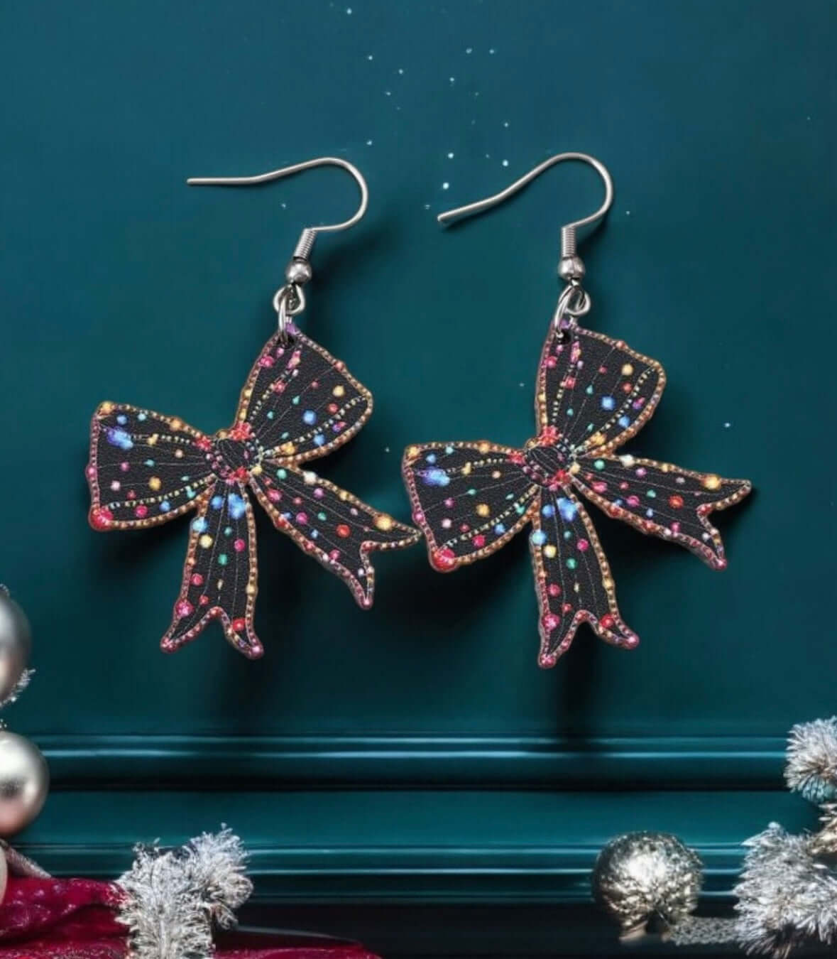 Vintage-inspired Christmas Twinkle Bow Earrings featuring colorful painted lights on a black bow design, perfect for festive occasions.