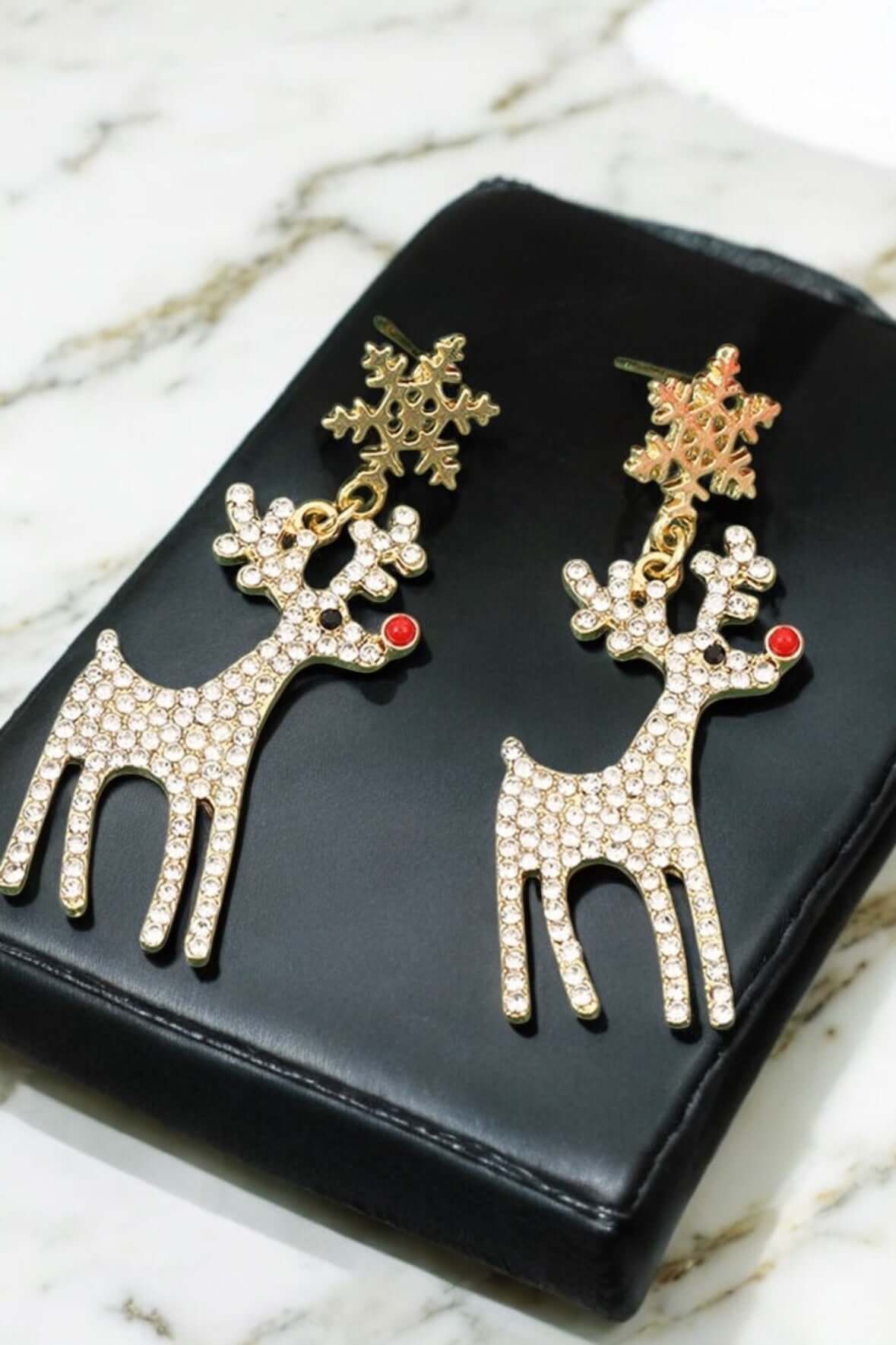 Luxury red-nosed reindeer earrings with rhinestones and snowflake design, perfect for festive holiday wear.