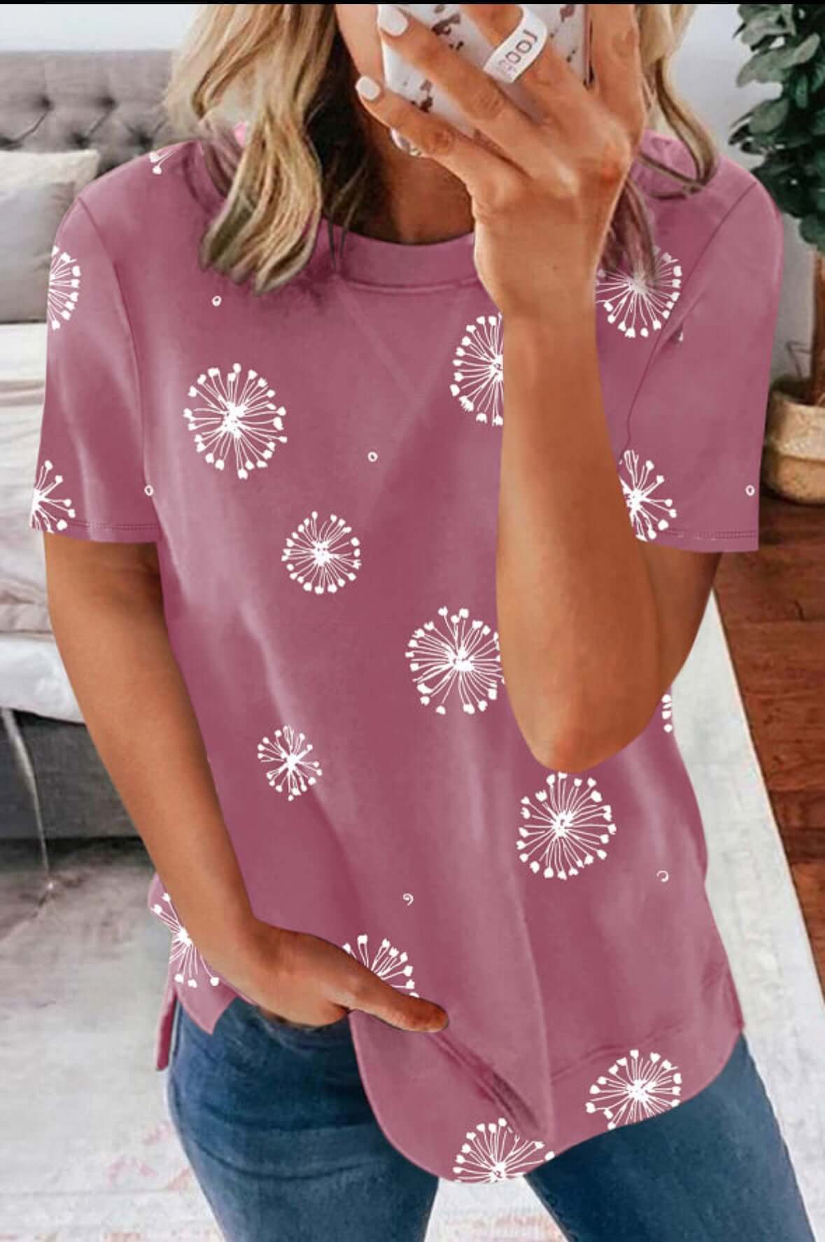 Soft pink Wishful Thinking Top with whimsical dandelion prints, perfect for summer style.