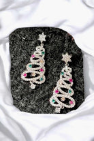 Oh Christmas Tree Earrings featuring colorful rhinestones and a sparkling star accent on a black background.