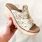CORKYS NEON MOON WEDGES showcasing a neutral faux suede upper with metallic studs and a cork wedge for stylish comfort.