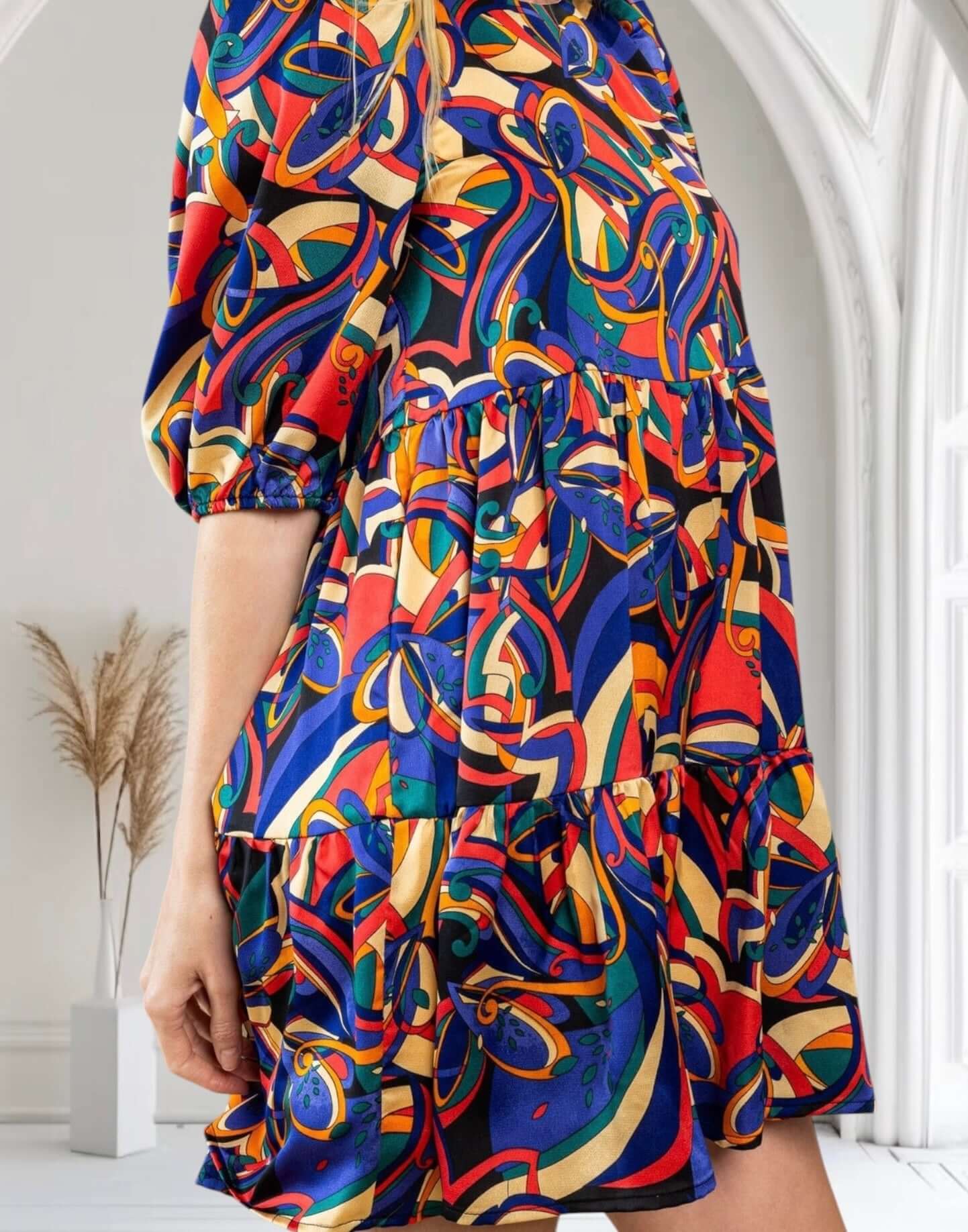 Vibrant abstract print dress with puff sleeves, perfect for stylish occasions, by TCEC.