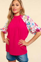 Bright pink PETAL PASSION TOP with floral half sleeves, perfect for stylish casual or dressy outfits.