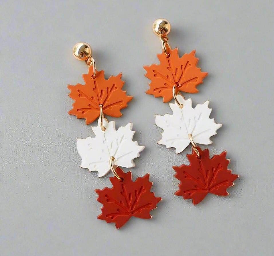 Elegant Falling Leaves Earrings with orange, white, and red leaf charms, showcasing autumn-inspired dangle jewelry.