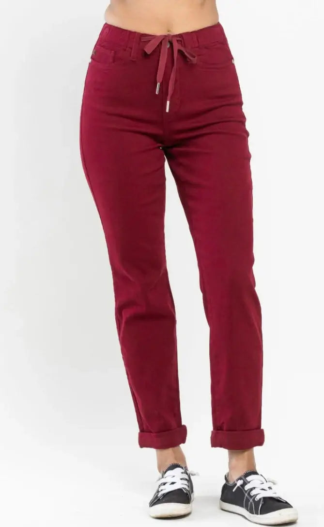 Crimson high rise joggers with drawstring waistband and comfortable fit by Judy Blue, paired with casual sneakers.