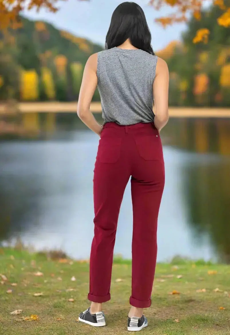 Woman wearing Judy Blue Bridget Joggers in crimson near lake in fall setting