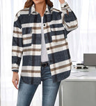 Woman wearing plaid Woodland Trail Shacket over a white shirt, styled with jeans, showcasing versatility and comfort.