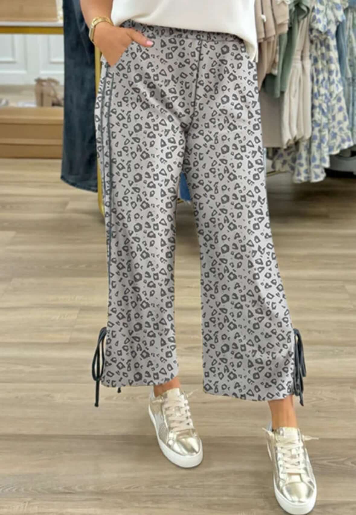 Stylish spotted spirit pants with drawstring hems, perfect for casual outfits and trendy looks.