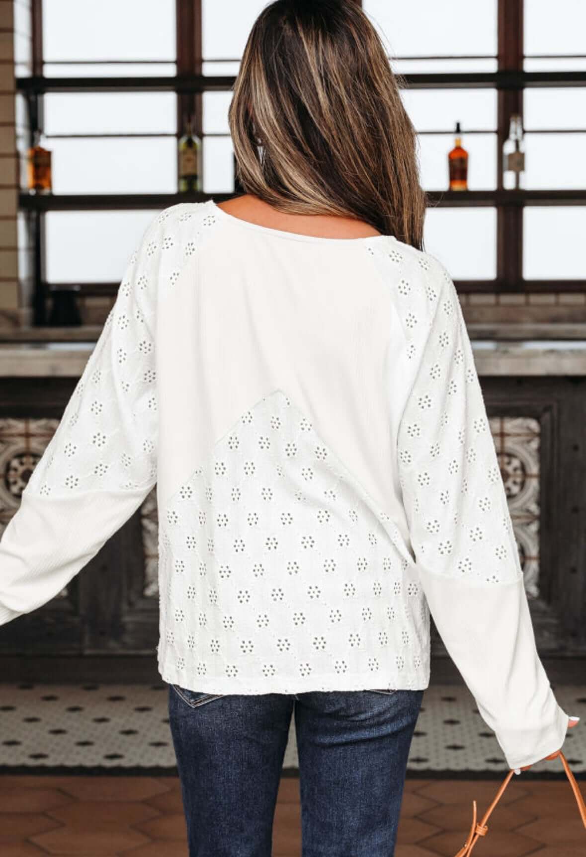 Back view of the FROSTED FUSION TOP showcasing its stylish design and elegant detailing.