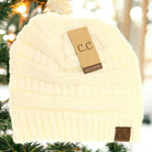 Classic C.C. beanie hat in white, cozy knit design, perfect for winter outfits. Hand wash recommended.