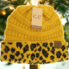 Classic CC Beanie in yellow with leopard print, perfect for cozy winter outfits. One size, hand wash only.