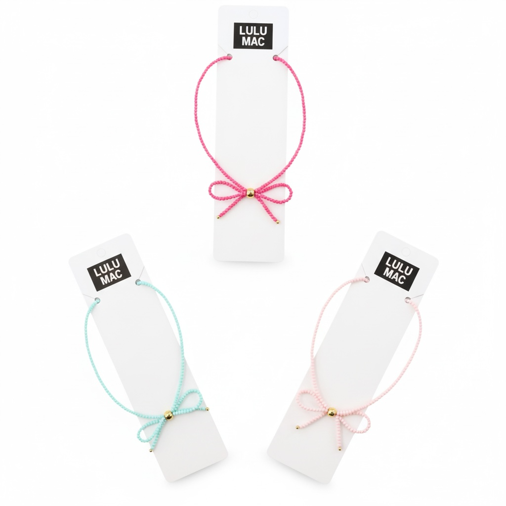 LULU MAC - Love Ties Necklace in hot pink, aqua, and light pink with bow design for a super cute, versatile look.